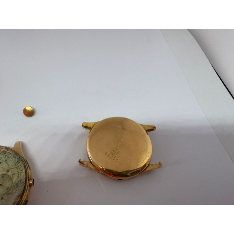 Elément de boîtier de montre en or jaune 750 millièmes (18K) et circulaire, numéroté 2229C. Poids : 5 g Boîtier de montre en or 