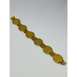 Bracelet articulé en or jaune 750 millièmes (18K) composé de six pièces de 10 francs NAPOLEON III années 1867/64/63 (X2)/62/66. 