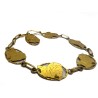 Bracelet articulé à mailles en or jaune 750 millièmes (18K) rythmées de cartouches représentant la carte de la GUYANE soulignée 